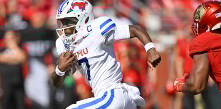 Oct 5, 2024; Louisville, Kentucky, USA; Southern Methodist Mustangs quarterback Kevin Jennings (7) runs the ball against the Louisville Cardinals during the first half at L&N Federal Credit Union Stadium. Southern Methodist defeated Louisville 34-27. Mandatory Credit: Jamie Rhodes-Imagn Images