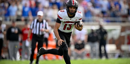 Nov 22, 2025; Dallas, Texas, USA; Louisville Cardinals quarterback Deuce Adams (13) runs with the ball against the SMU Mustangs during the first half at Gerald J. Ford Stadium. Mandatory Credit: Jerome Miron-Imagn Images
