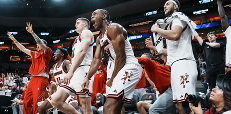 Louisville Cardinals bench erupts in cheers as teammate Cole Sherman hits a late three-point shot against Eastern Michigan as the Cards roll 87-46 to improve to 6-0 Monday night, Nov. 24, 2025 at the KFC Yum! Center in Louisville, Kentucky.