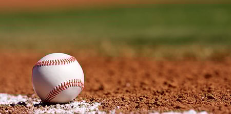 Baseball on the Chalk Line of the Infield