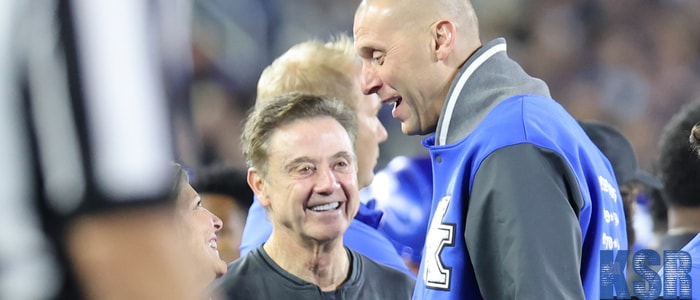 Mark Pope and Rick Pitino talk on the sideline at Kroger Field - Dr. Michael Huang, Kentucky Sports Radio