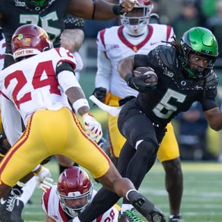 Oregon running back Noah Whittington carries the ball as the Oregon Ducks host the USC Trojans on Nov. 22, 2025, at Autzen Stadium in Eugene, Oregon