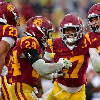 USC Trojans cornerback Alex Graham (27) safety Christian Pierce (24) cornerback Decarlos Nicholson (17) and safety Kennedy Urlacher (28) celebrate after Iowa Hawkeyes turn the ball over on fourth down during the second half at the Los Angeles Memorial Coliseum
