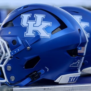 Kentucky football helmet on the sideline, via Dr. Michael Huang, KSR
