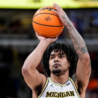 Michigan Wolverines basketball point guard Elliot Cadeau. (Photo by Junfu Han / USA TODAY NETWORK via Imagn Images)