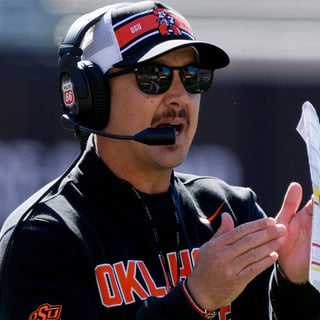 Oklahoma State coach Eric Morris calls a time out during a spring football game for the Oklahoma State University Cowboys at