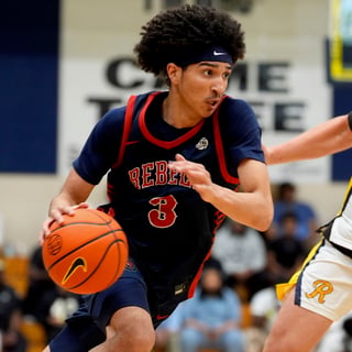 Florida Rebels Cayden Daughtry (3) dribbles as NY Rens Bridgie McMillan (12) defends during the third day of the 2026 Nike EYBL Peach Jam at Riverview Park Activities Center in North Augusta, S.C., on Thursday, July 16, 2026. The NY Rens defeated the Florida Rebels 84-83.