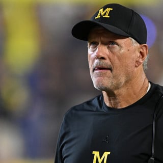 Sep 5, 2026; Ann Arbor, Michigan, USA; Michigan head coach Kyle Whittingham looks at the scoreboard during a break in the action against Western Michigan in the second quarter at Michigan Stadium. Mandatory Credit: Lon Horwedel-Imagn Images