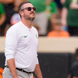 Oregon head coach Dan Lanning takes in the rain as the Oregon Ducks face the Oklahoma State Cowboys on Sept. 12, 2026, at Boone