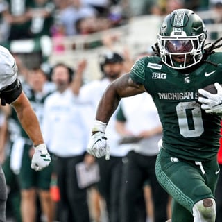 Michigan State’s Cam Edwards runs for a gain against Eastern Michigan during the fourth quarter on Saturday, Sept. 12, 2026, at Spartan Stadium in East Lansing. - Nick King, USA TODAY Sports