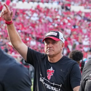 Texas Tech head coach Joey McGuire gestures to the fans before a non-conference Division I football game, Saturday, Sept. 5,