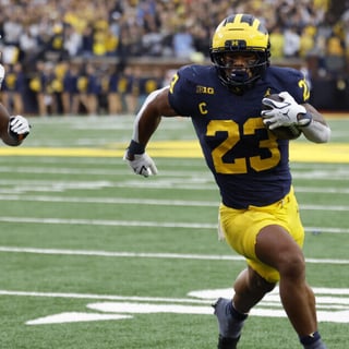 Sep 19, 2026; Ann Arbor, Michigan, USA; Michigan Wolverines running back Jordan Marshall (23) scores a touchdown with Texas El Paso Miners defensive back Adarius Hutchinson (32) defending during the third quarter at Michigan Stadium. Mandatory Credit: Rick Osentoski-Imagn Images
