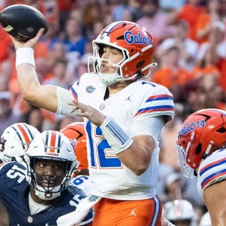 Florida Gators quarterback Aaron Philo (12) throws the ball as Auburn Tigers take on Florida Gators at Jordan-Hare Stadium in