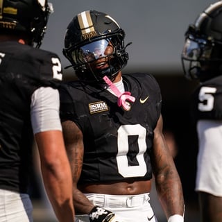 Vanderbilt wide receiver Junior Sherrill (0) celebrates his touchdown against NC State with quarterback Jared Curtis (2) and