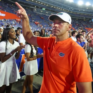 Florida head coach Jon Sumrall reacts to fans after Florida beat Ole Miss 52-28 after the second half an NCAA football game