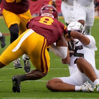 2026-09-27T004052Z_907802717_MT1USATODAY29926721_RTRMADP_3_OREGON-QUARTERBACK-DANTE-MOORE-IS-HIT-AFTER-SLIDING-BY-USC