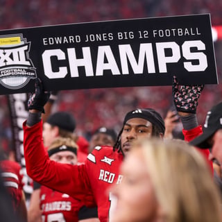 Texas Tech's Charles Esters III holds a sign after the Big 12 Conference championship football game, Saturday, Nov. 6, 2025, at