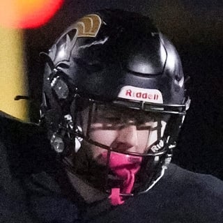 Paramus Catholic sophomore Walker Snee (13) runs with the ball as DePaul defends during a game at Paramus Catholic high school,