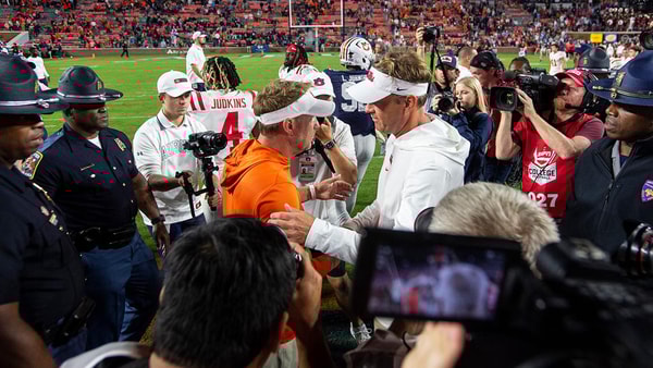 Auburn head coach Hugh Freeze and Ole Miss coach Lane Kiffin