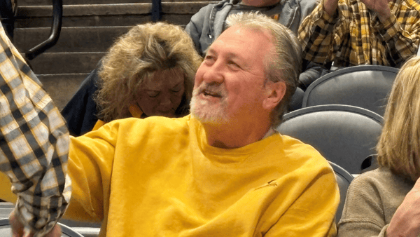 Bob Huggins sits in the stands a West Virginia game with his wife June for the Bearcats and Mountaineers game - The Enquirer/Scott Springer-USA TODAY NETWORK