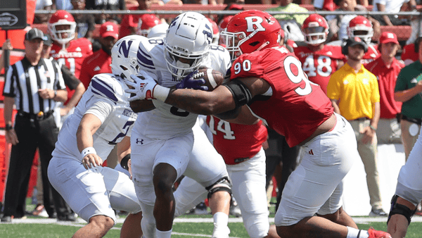 Sep 3, 2023; Piscataway, New Jersey, USA; Northwestern Wildcats wide receiver A.J. Henning (8) is tackled by Rutgers Scarlet Knights defensive lineman Rene Konga (90) during the second half at SHI Stadium. Mandatory (Vincent Carchietta-USA TODAY Sports)