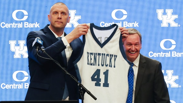 Former Kentucky player turned head coach Mark Pope holds up his game-worn No. 41 Kentucky jersey at his introductory press conference - © Sam Upshaw Jr./Courier Journal / USA TODAY NETWORK