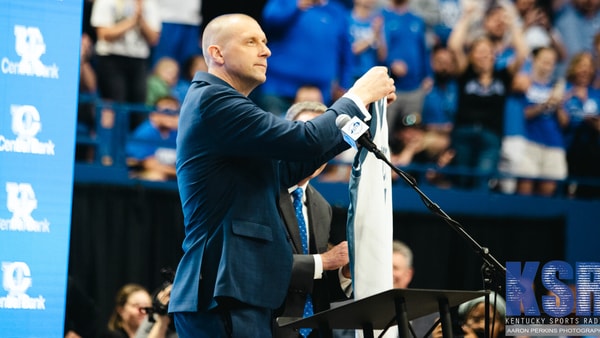 Mark Pope holds up his old jersey at his introductory press conference - Aaron Perkins, Kentucky Sports Radio