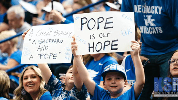 Kentucky fans hold up signs for Mark Pope at his introductory press conference - Aaron Perkins, Kentucky Sports Radio