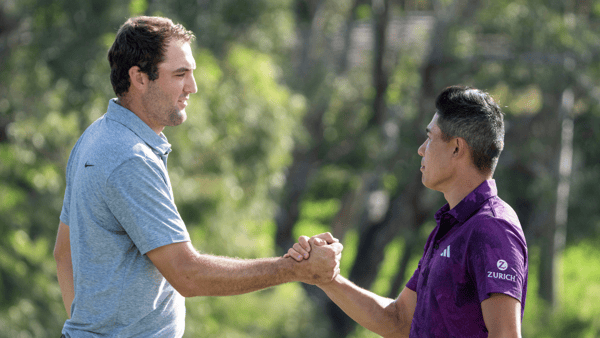 January 7, 2023; Maui, Hawaii, USA; Scottie Scheffler (left) and Collin Morikawa (right) shake hands on the 18th hole during the third round of the Sentry Tournament of Champions golf tournament at Kapalua Resort - The Plantation Course. (Kyle Terada-USA TODAY Sports)