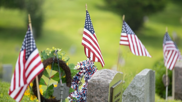 American flags mark the graves of United States military veterans Sunday, May 26, 2024, in Streetsboro’s Evergreen Cemetery - © Nicholas McLaughlin / USA TODAY NETWORK