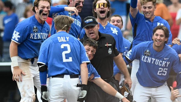Jun 15, 2024; Omaha, NE, USA;  Kentucky Wildcats third baseman Mitchell Daly (2) and teammate celebrate after hitting a walk off home run against the NC State Wolfpack during the tenth inning at Charles Schwab Filed Omaha. (Steven Branscombe-USA TODAY Sports)