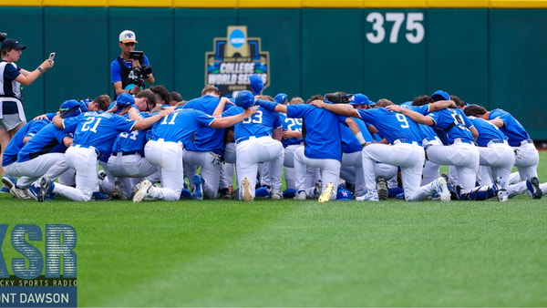 The Kentucky Baseball team huddles ahead of a game at the College World Series - Mont Dawson, Kentucky Sports Radio