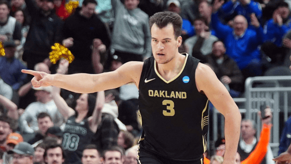 Oakland Golden Grizzlies guard Jack Gohlke (3) celebrates after making a three point during the first half of the game against the North Carolina State Wolfpack in the second round of the 2024 NCAA Tournament at PPG Paints Arena - Gregory Fisher-USA TODAY Sports