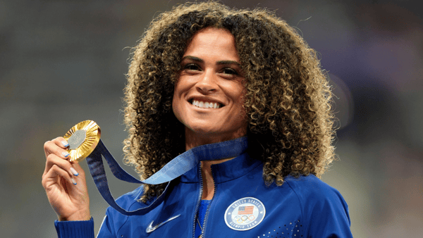 Aug 9, 2024; Paris Saint-Denis, France; Sydney McLaughlin-Levrone (USA) celebrates her gold medal in the womenís 400m hurdles during the Paris 2024 Olympic Summer Games at Stade de France. Mandatory Credit: Andrew Nelles-USA TODAY Sports