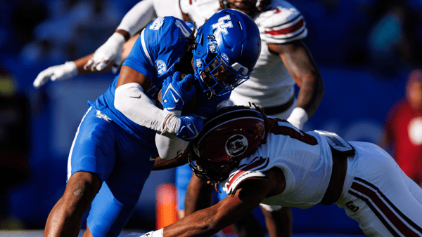 Kentucky RB Demie Sumo-Karngbaye is tackled by a South Carolina defender