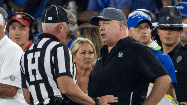 Kentucky Wildcats head coach Mark Stoops talks to a referee after a play against the Georgia Bulldogs at Kroger Field. Mandatory Credit: Tanner Pearson-Imagn Images