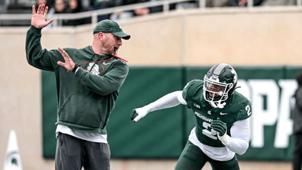 Michigan State's Khris Bogle, right, runs a drill with rush ends coach Chad Wilt during the Spring Showcase on Saturday, April 20, 2024, at Spartan Stadium in East Lansing - Nick King, USA TODAY Sports