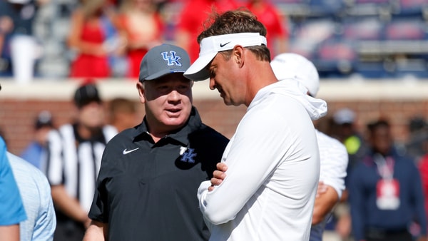 Kentucky Wildcats head coach Mark Stoops (left) and Mississippi Rebels head coach Lane Kiffin (right) talk prior tot the game at Vaught-Hemingway Stadium. Mandatory Credit: Petre Thomas-Imagn Images