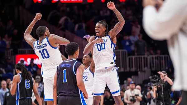 Kentucky C Brandon Garrison and Otega Oweh celebrate a win over Duke