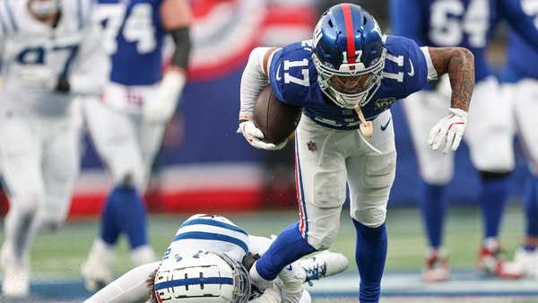 Dec 29, 2024; East Rutherford, New Jersey, USA; New York Giants wide receiver Wan'Dale Robinson (17) breaks a tackle by Indianapolis Colts safety Julian Blackmon (32) during the second half at MetLife Stadium. Mandatory Credit: Vincent Carchietta-Imagn Images