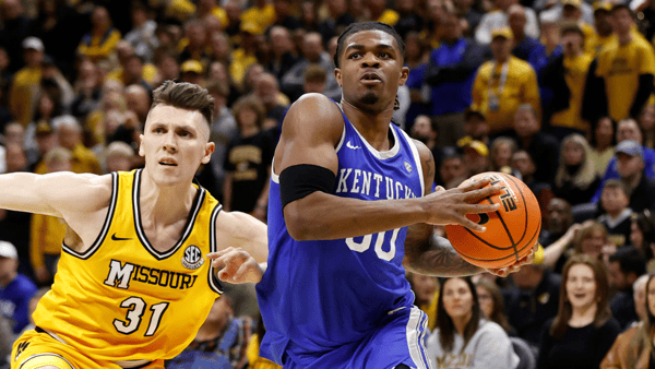 Mar 8, 2025; Columbia, Missouri, USA; Kentucky Wildcats guard Otega Oweh (00) drives past Missouri Tigers guard Caleb Grill (31) in the second half at Mizzou Arena. Mandatory Credit: Gary Rohman-Imagn Images