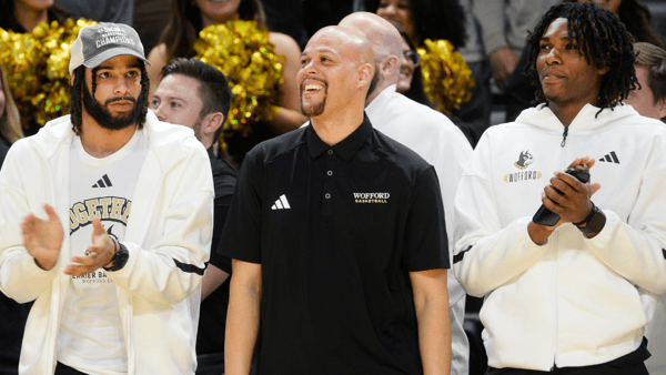 Wofford head coach Dwight Perry (middle) - ALEX HICKS JR./SPARTANBURG HERALD-JOURNAL / USA TODAY NETWORK via Imagn Images