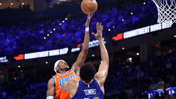 Jan 3, 2025; Oklahoma City, Oklahoma, USA; Oklahoma City Thunder guard Shai Gilgeous-Alexander (2) shoots as New York Knicks center Karl-Anthony Towns (32) defends during the second half at Paycom Center. Mandatory Credit: Alonzo Adams-Imagn Images