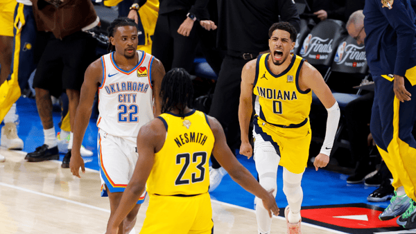 Jun 5, 2025; Oklahoma City, Oklahoma, USA; Indiana Pacers guard Tyrese Haliburton (0) and forward Aaron Nesmith (23) celebrate after Haliburton makes the game winning shot as Oklahoma City Thunder guard Cason Wallace (22) looks on during the fourth quarter during game one of the 2025 NBA Finals at Paycom Center. Mandatory Credit: Alonzo Adams-Imagn Images