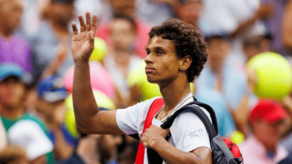 Aug 29, 2024; Flushing, NY, USA; Gabriel Diallo of Canada in action against Tommy Paul of the United States on day six of the 2024 U.S. Open tennis tournament at the USTA Billie Jean King National Tennis Center. Mandatory Credit: Mike Frey-Imagn Images