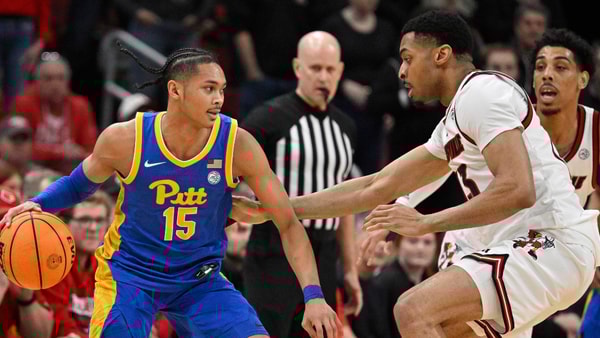 Mar 1, 2025; Louisville, Kentucky, USA; Pittsburgh Panthers guard Jaland Lowe (15) dribbles against Louisville Cardinals center Frank Anselem-Ibe (13) during the second half at KFC Yum! Center. Louisville defeated Pittsburgh 79-68. Mandatory Credit: Jamie Rhodes-Imagn Images