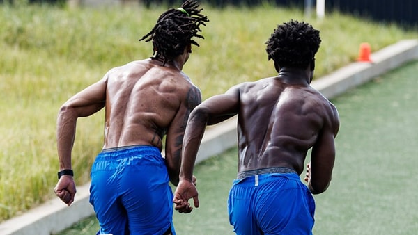 The Kentucky football team sprints hills during summer conditioning, via UK Athletics
