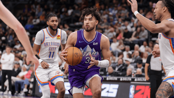 Apr 11, 2025; Salt Lake City, Utah, USA; Utah Jazz guard Johnny Juzang (33) looks to past the ball during the second half against the Oklahoma City Thunder at Delta Center. Mandatory Credit: Chris Nicoll-Imagn Images