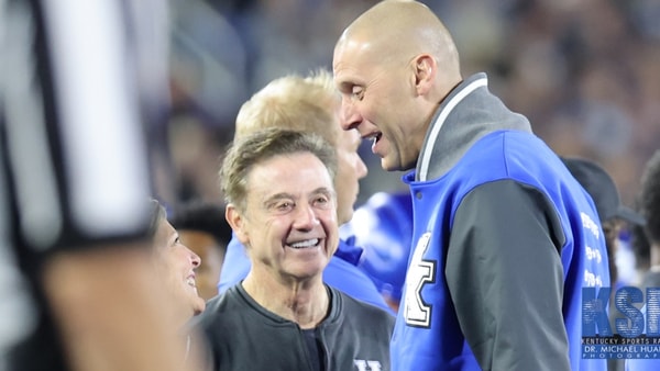 Mark Pope and Rick Pitino talk on the sideline at Kroger Field - Dr. Michael Huang, Kentucky Sports Radio