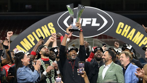Jun 14, 2025; St. Louis, MO, USA; DC Defenders head coach Shannon Harris raises the UFL Championship trophy after defeating the Michigan Panthers in the 2025 UFL Championship at The Dome at America’s Center. Mandatory Credit: Jeff Le-Imagn Images